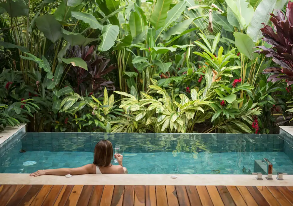 Woman in plunge pool at Nayara Springs, Costa Rica 