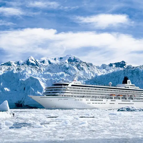 Crystal cruise ship in front of a glacier